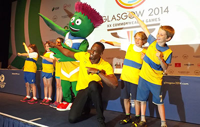 Usain Bolt with kids in Glasgow
